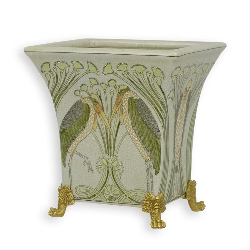 Casa Padrino Jugendstil Porzellan Übertopf Kraniche Creme / Grün / Gold 16,7 x 20,7 x H. 21,5 cm - Blumentopf mit Bronze Löwenfüßen - Barock & Jugendstil Deko Accessoires